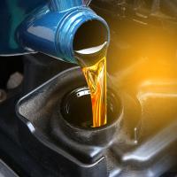 Fresh oil being poured into engine